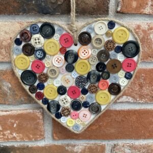 Small painted wooden heart with recycled buttons